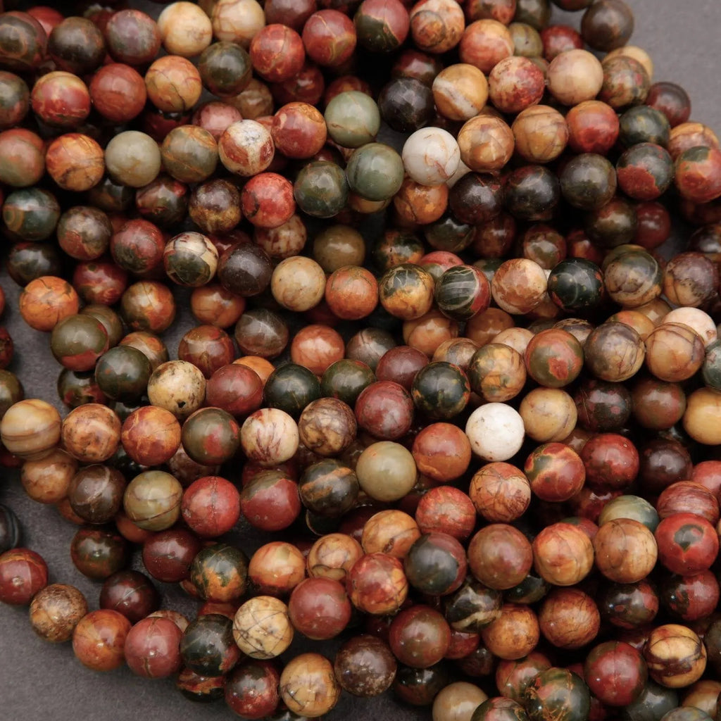 Close-up of multicolored marbled beads on a dark background