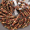 Multicolored marbled beads with price tags on a gray surface