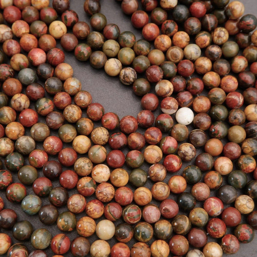 Close-up of multicolored marbled beads on a dark background