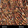 Close-up of multicolored beads with size labels '6mm' and '8mm'.