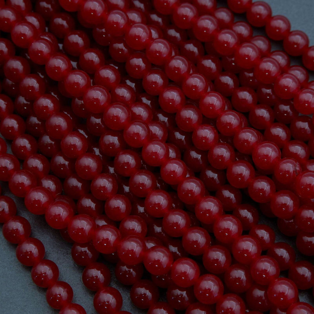 Close-up of red beads on a dark background
