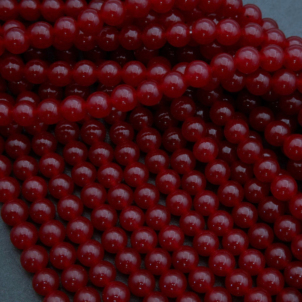 Close-up of red beads on a dark background