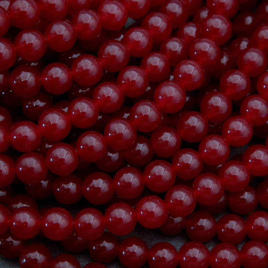 Close-up of red beads on a dark background
