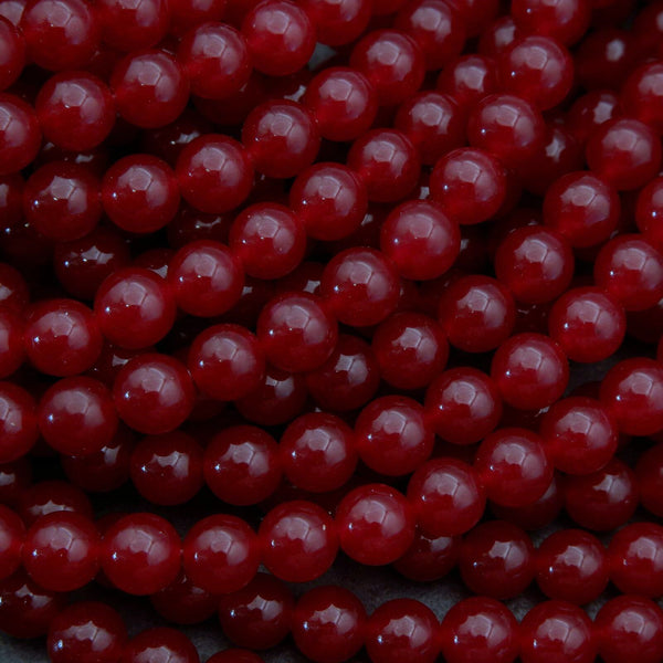Close-up of red beads on a dark background