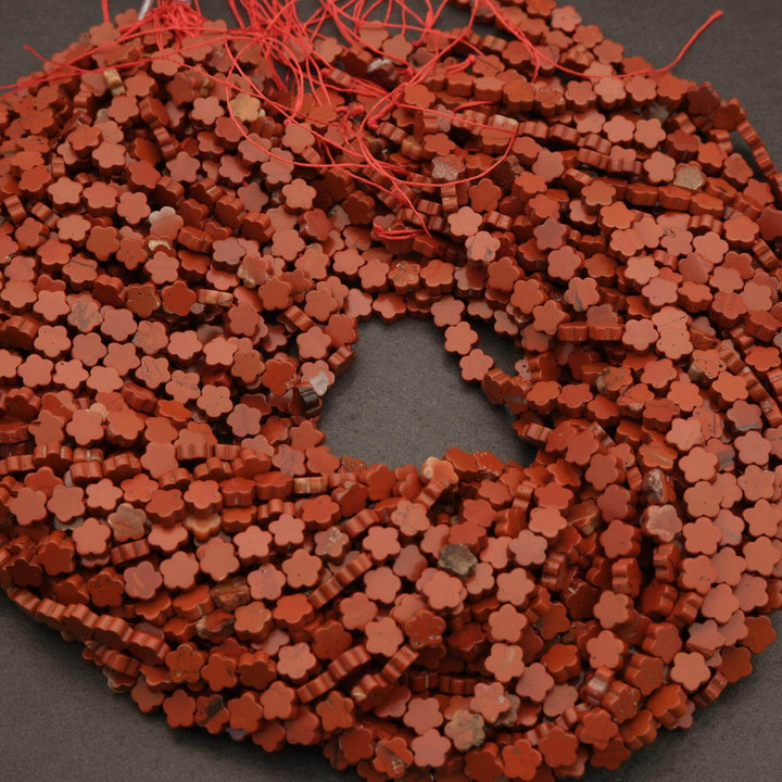 Close-up of a red woven mat with a central hole on a dark background