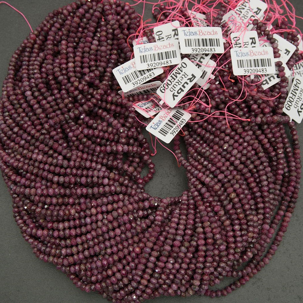 Faceted ruby beads in wine and raspberry hues