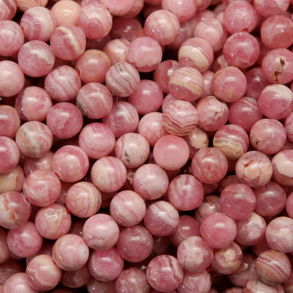 Striped white and pink rhodochrosite beads.