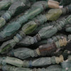 Close-up of green and brown glass beads