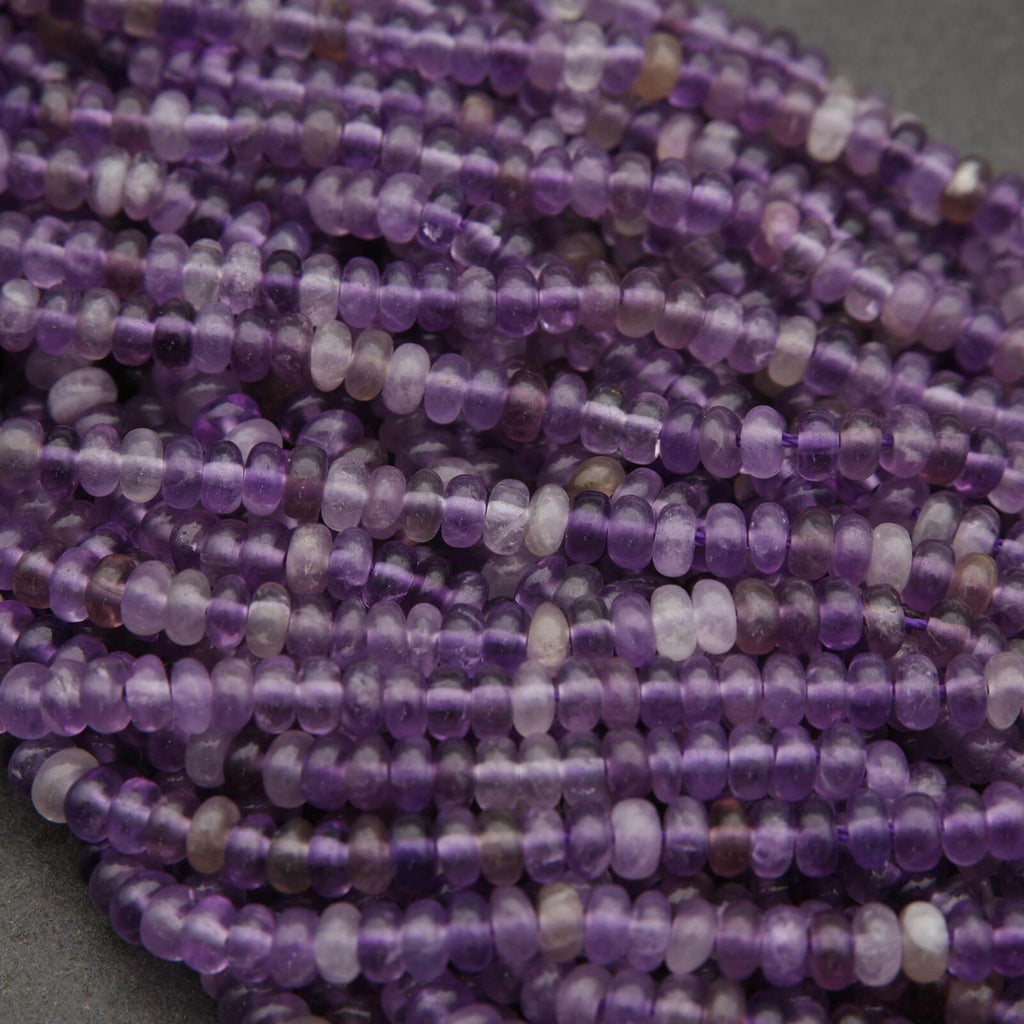 Close-up of purple beads on a gray background
