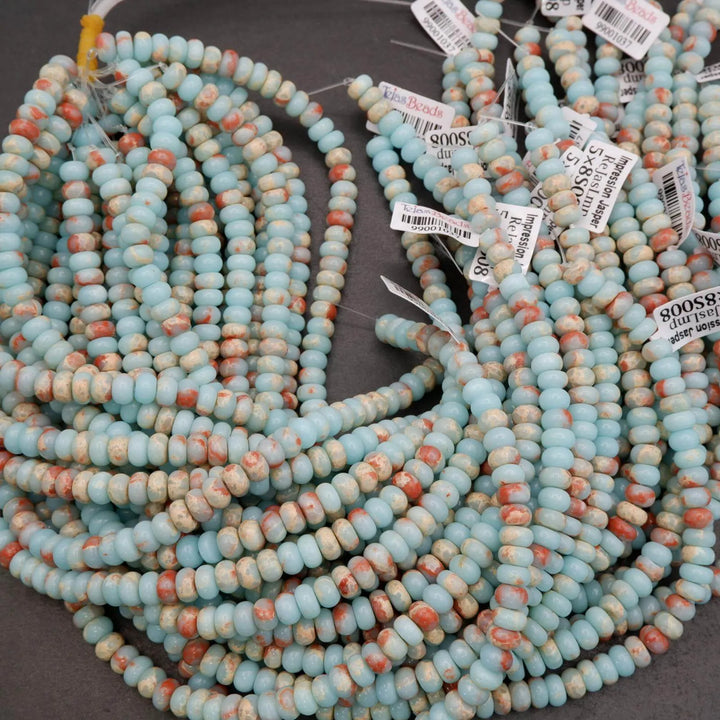 Soothing blues, creams, and warm earth tones with natural marbled patterns.