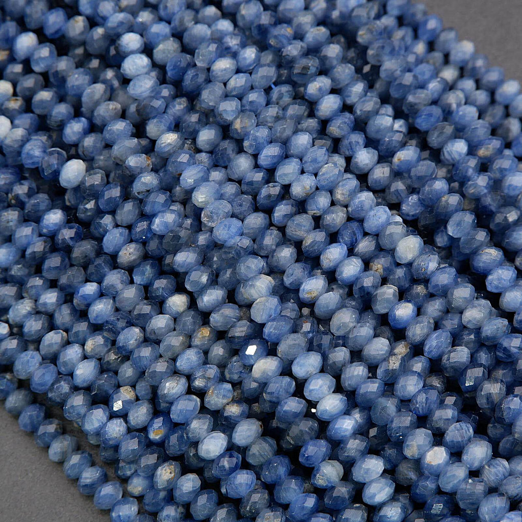 Close-up of blue faceted beads on a gray background