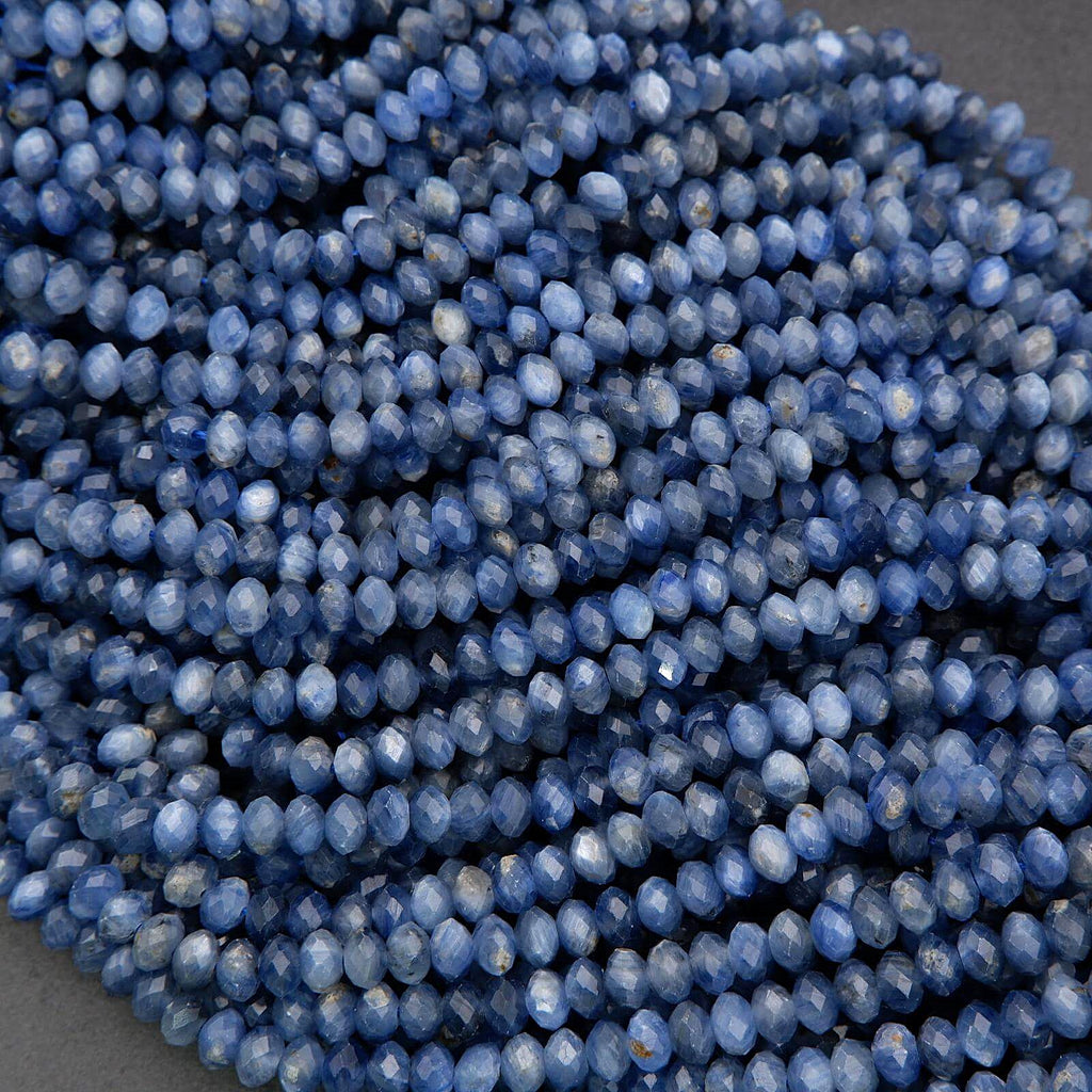 Close-up of blue faceted beads on a gray background