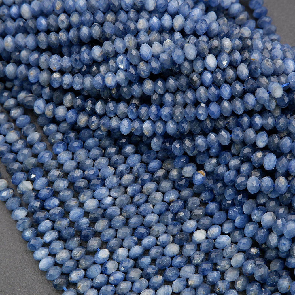 Close-up of blue faceted beads on a gray background