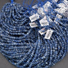 Blue beads with price tags on a gray background