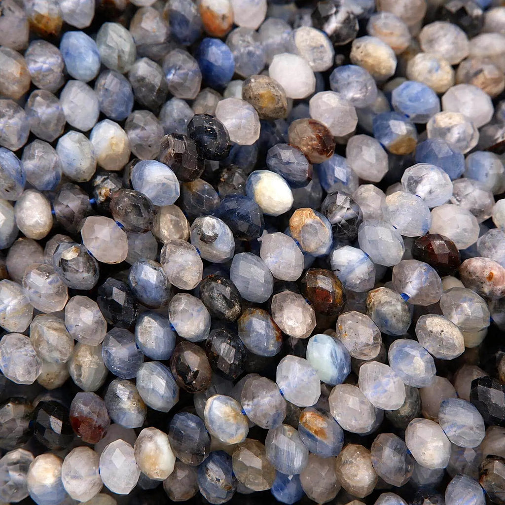 Close-up of faceted gemstones in various colors