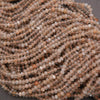 Close-up of a string of small, round beads on a dark background