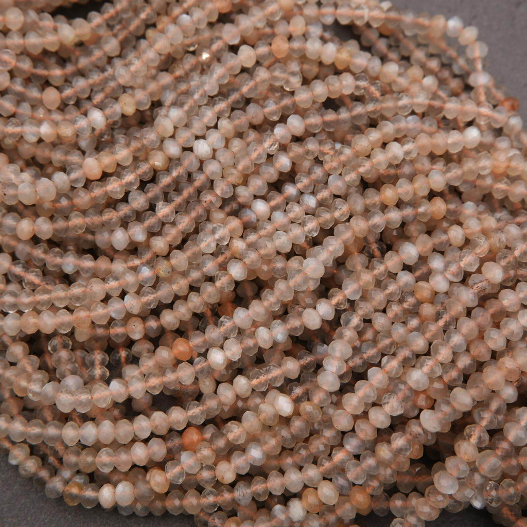Close-up of a string of small, round beads on a dark background