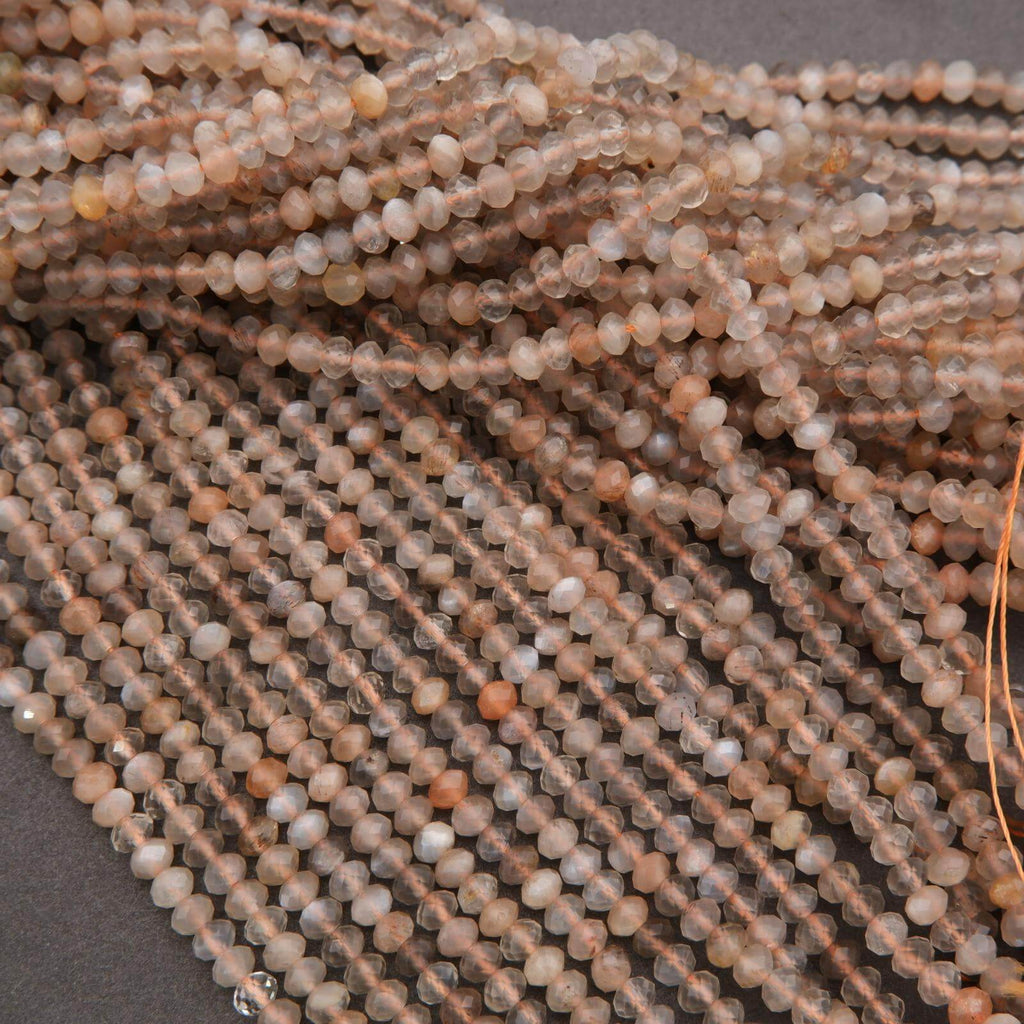 Close-up of strands of small beads on a dark background
