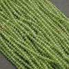 Yellow-green translucent rondelle shape faceted beads.