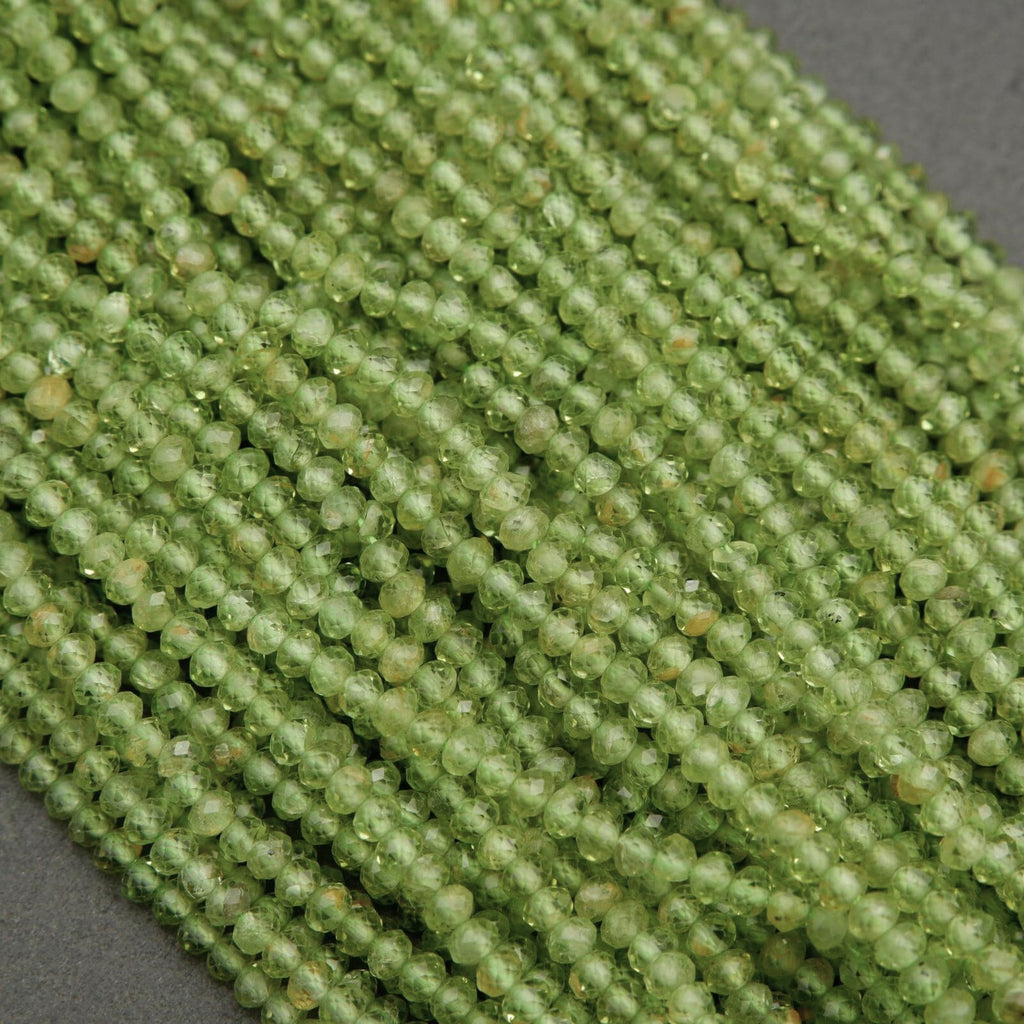 Yellow-green translucent rondelle shape faceted beads.