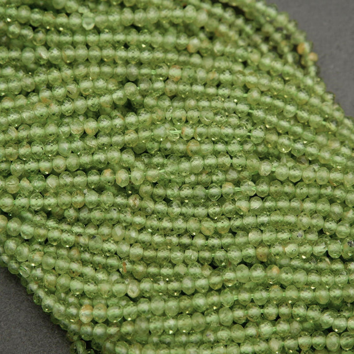 Yellow-green translucent rondelle shape faceted beads.
