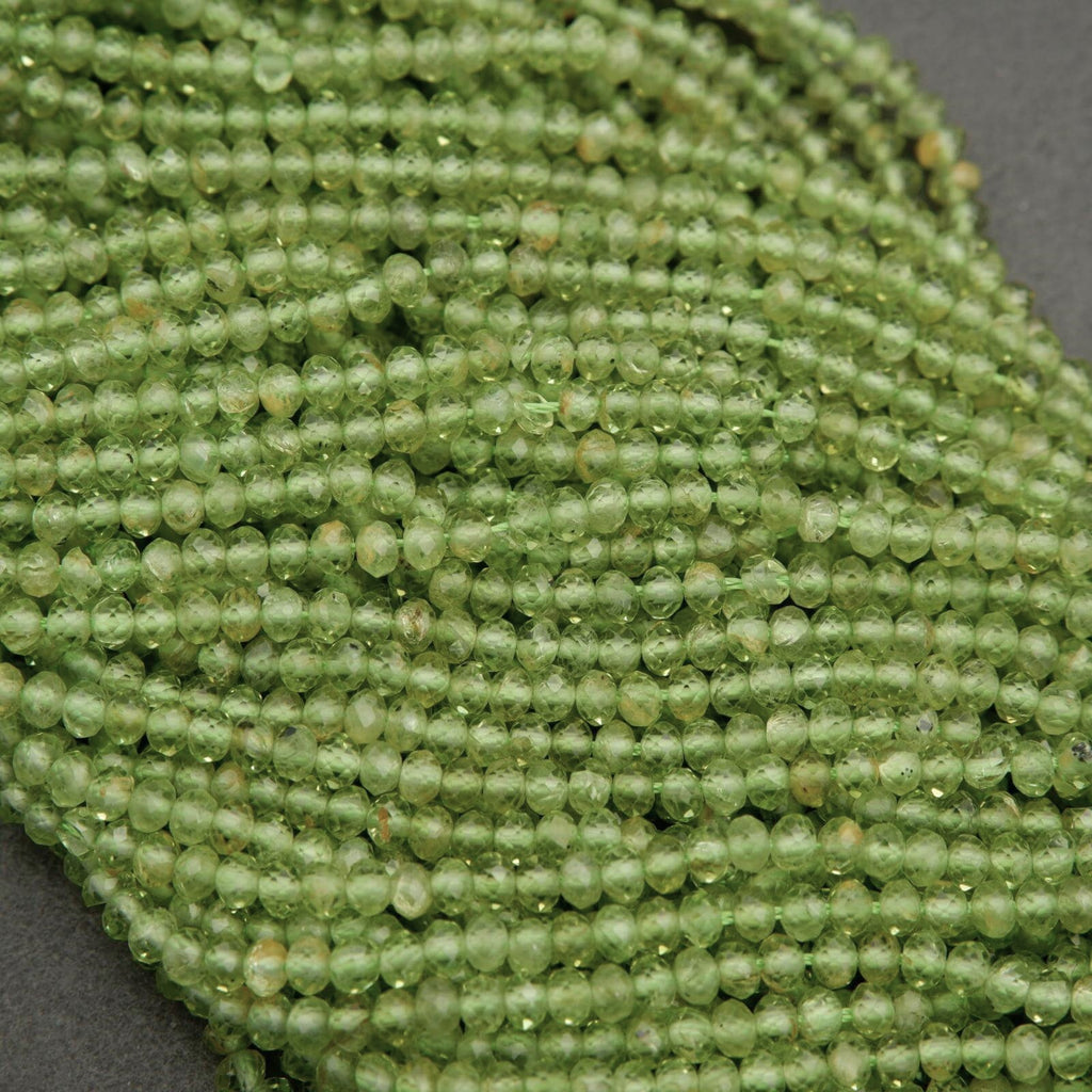 Yellow-green translucent rondelle shape faceted beads.