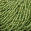 Yellow-green translucent rondelle shape faceted beads.