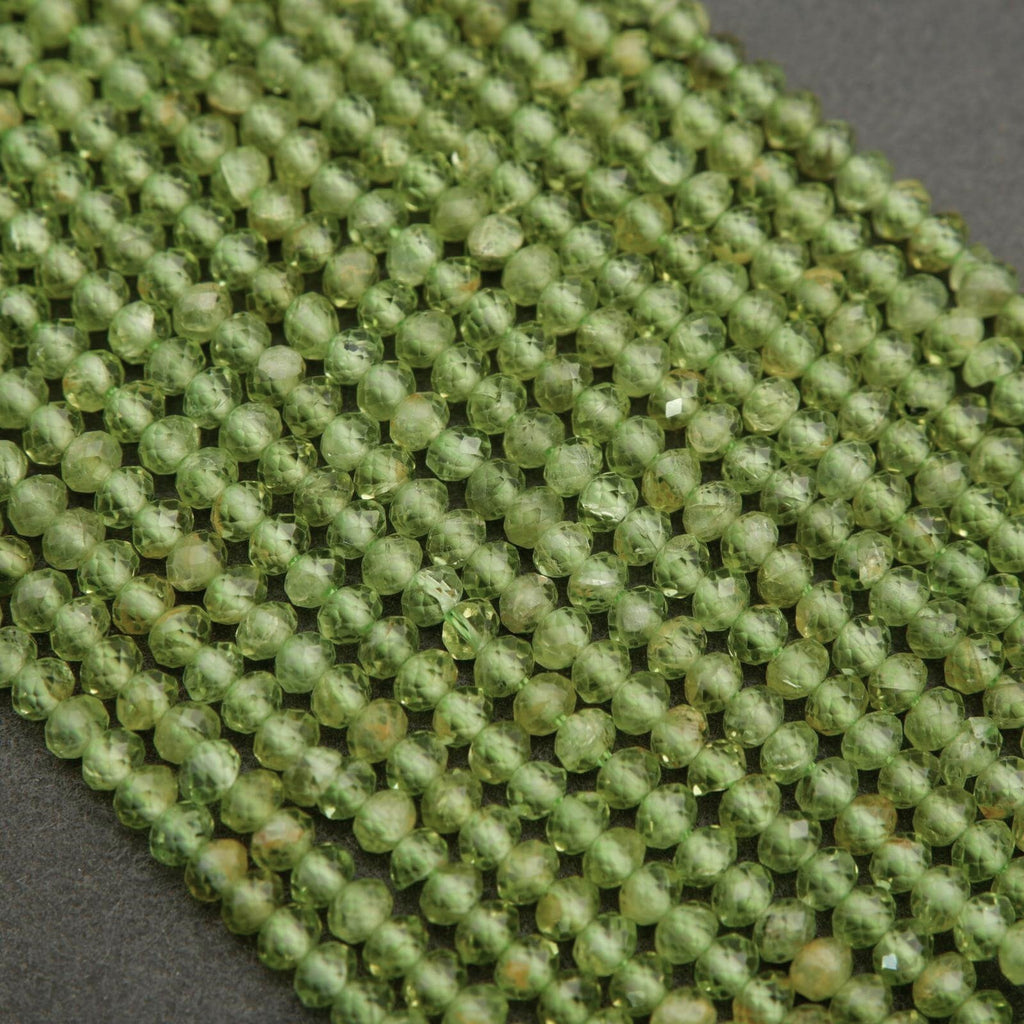 Yellow-green translucent rondelle shape faceted beads.