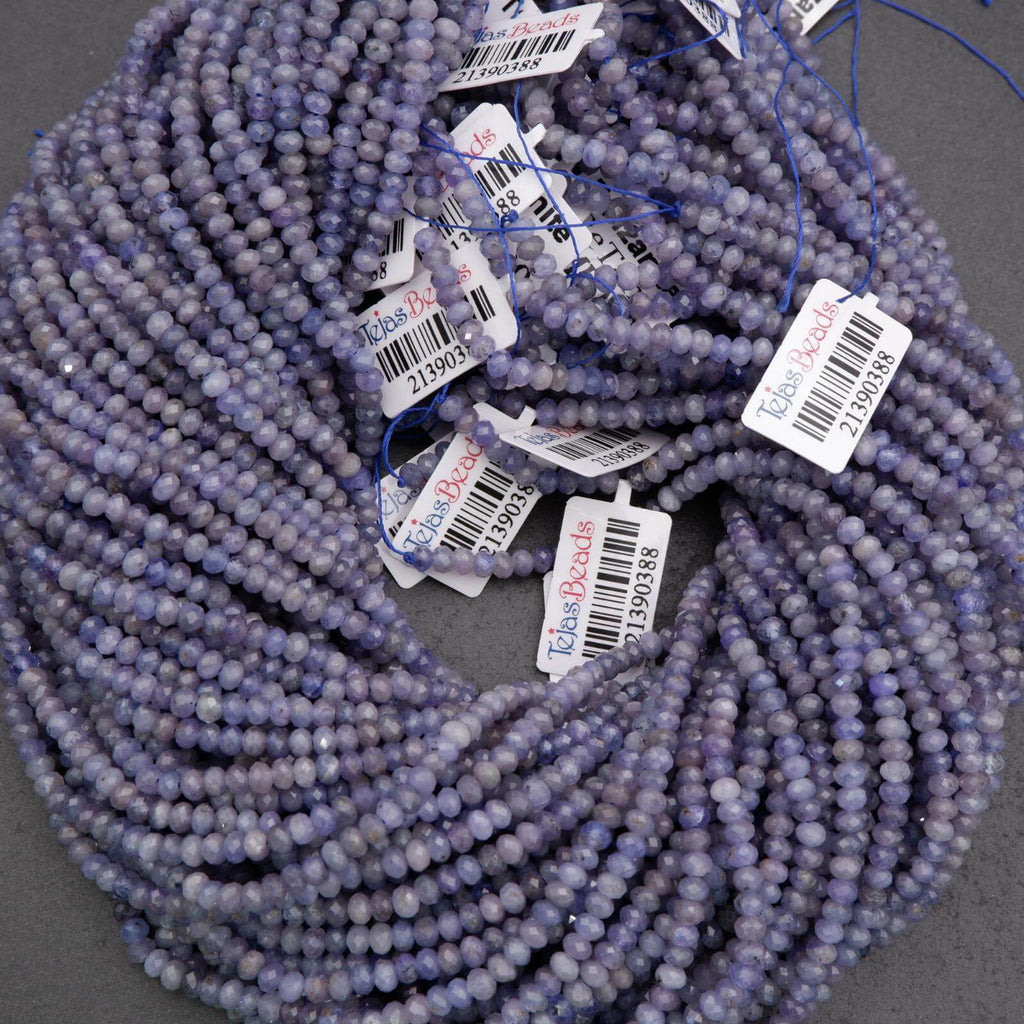 Purple beads with price tags on a gray background