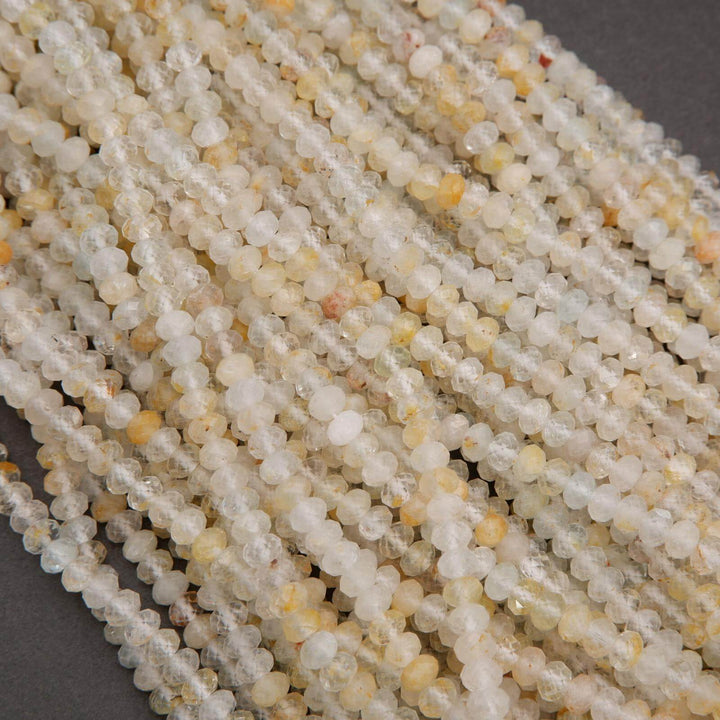 Rondelle Topaz Beads with faceted finish yellow inclusions.