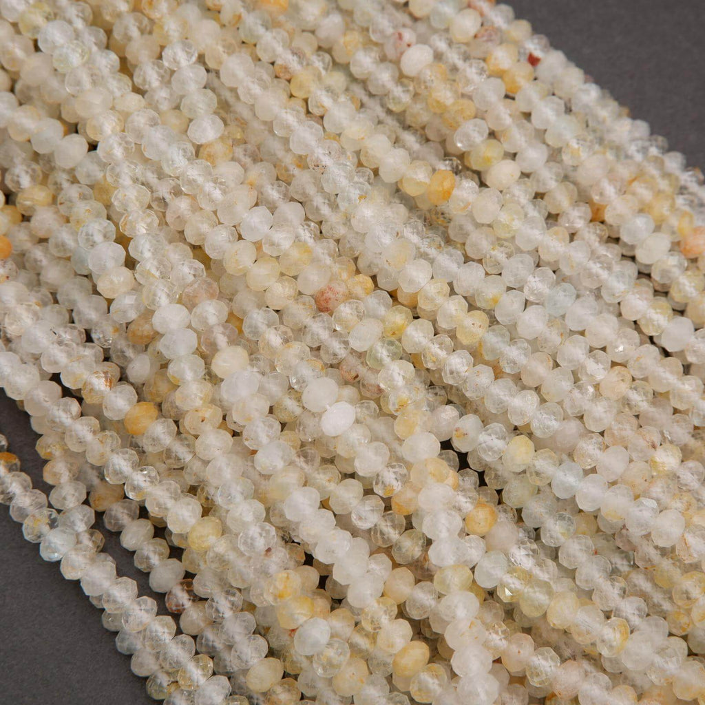 Rondelle Topaz Beads with faceted finish yellow inclusions.