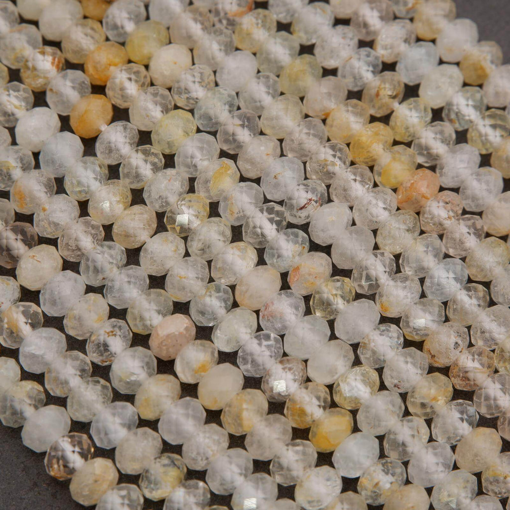 Rondelle Topaz Beads with faceted finish yellow inclusions.