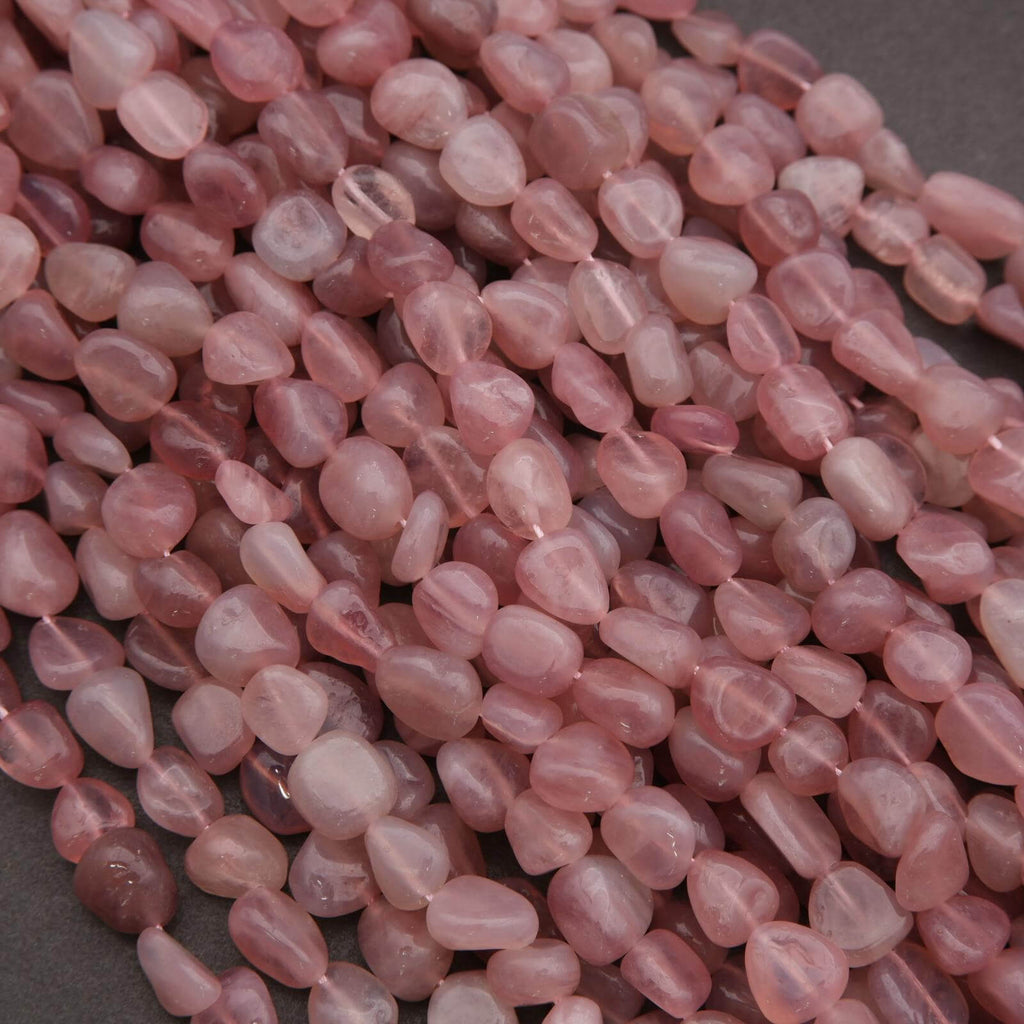 Close-up of pink beads on a dark background