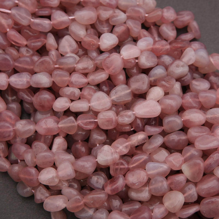 Close-up of pink heart-shaped stones on a gray background