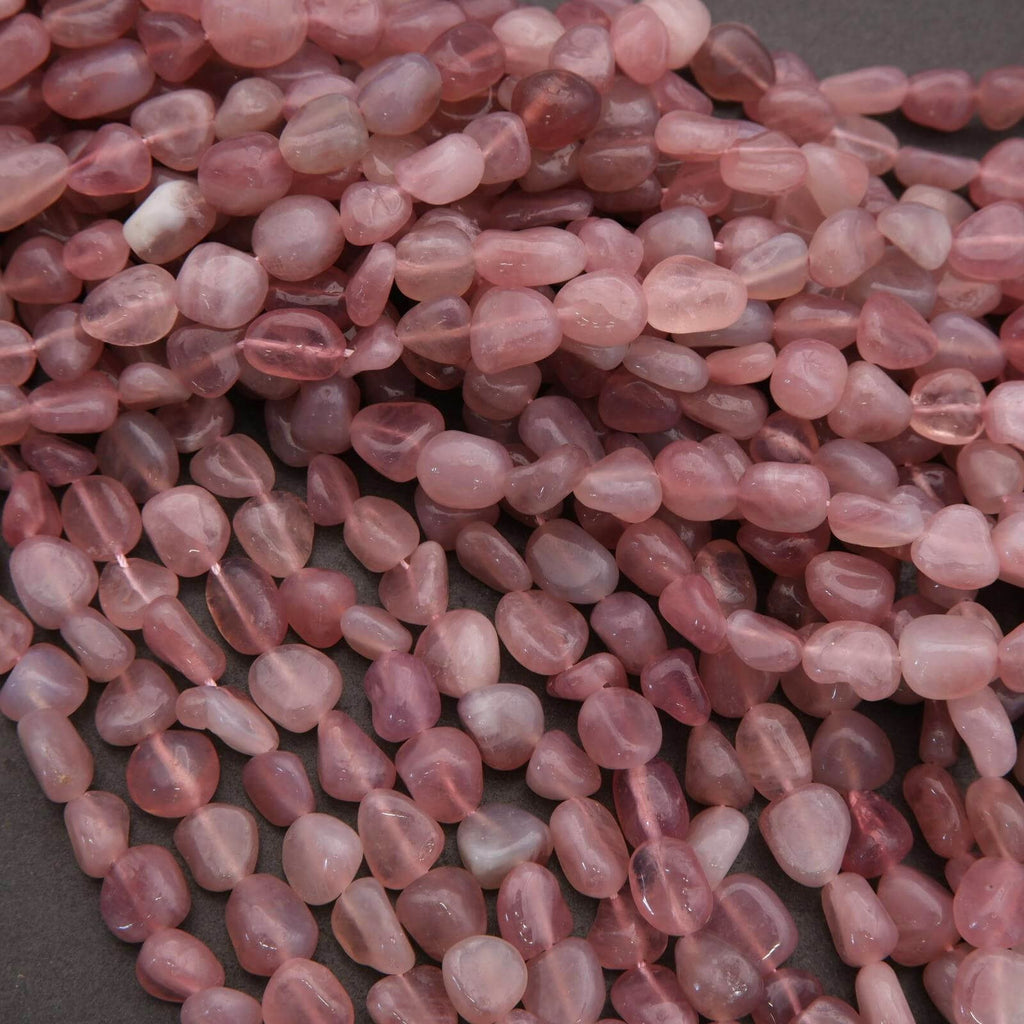 Close-up of pink pebbles on a dark surface