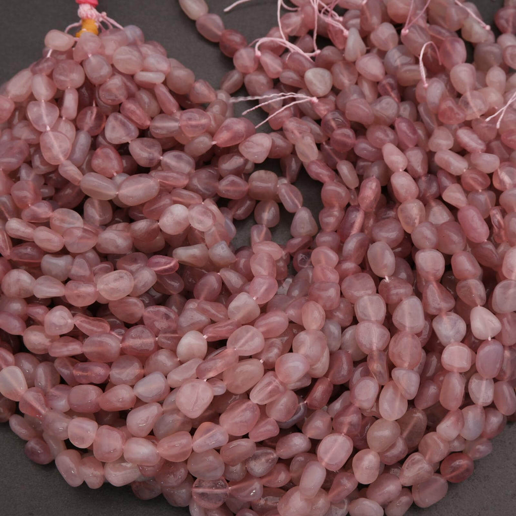 Close-up of pink beads on a dark background