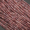 Close-up of pink beads on a gray background