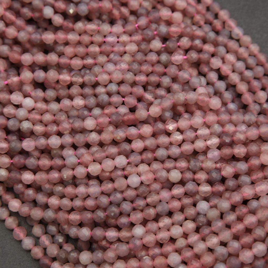 Close-up of pink beads on a dark background