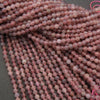 Close-up of pink beads on a gray background