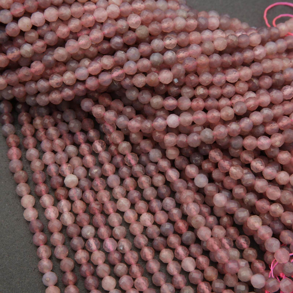 Close-up of pink beads on a gray background