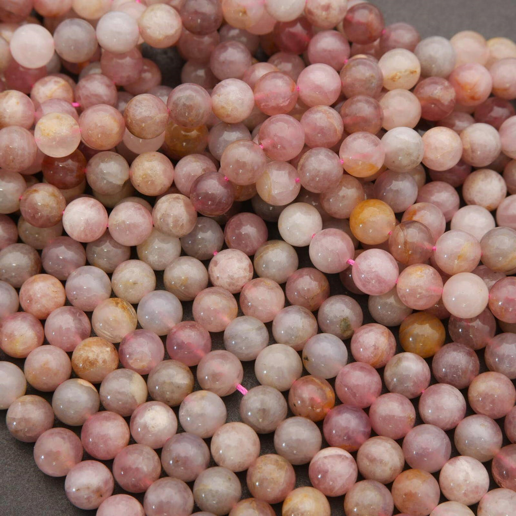 Close-up of pink and brown marbled beads on a gray background