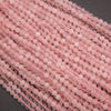 Close-up of pink beads on a dark background