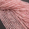 Close-up of pink beads on a dark background