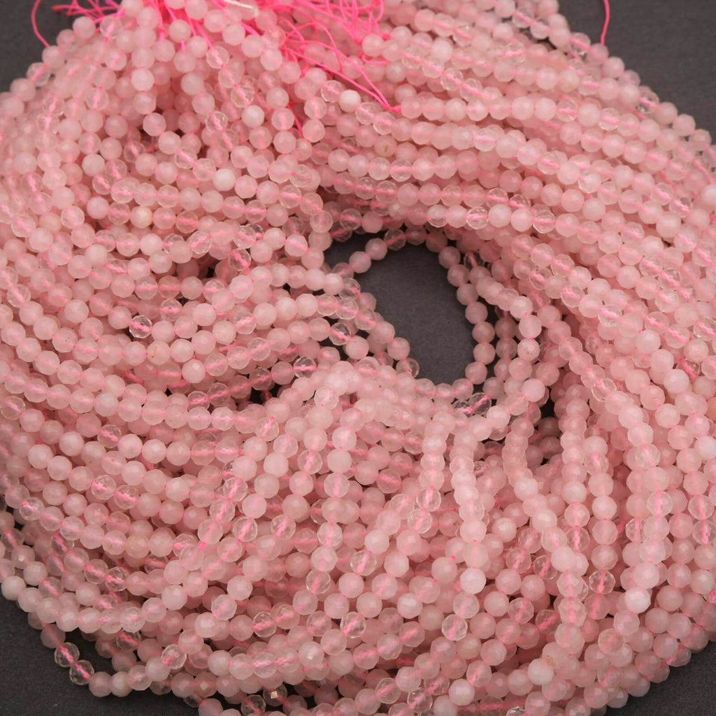 Pink glass beads on a dark background