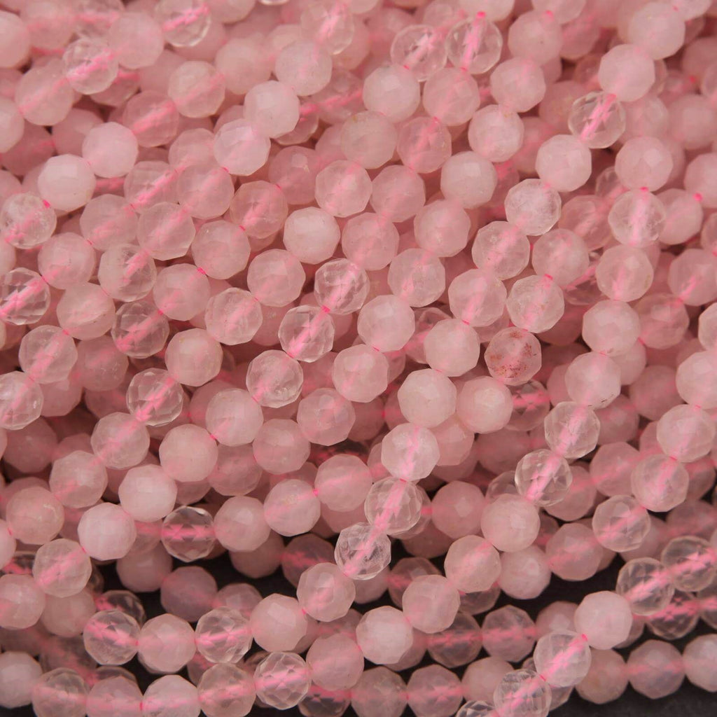 Close-up of pink beads on a dark background