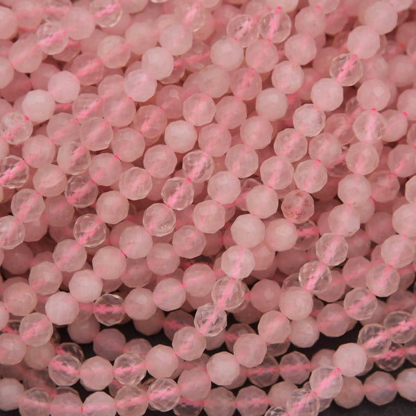 Close-up of pink beads on a dark background