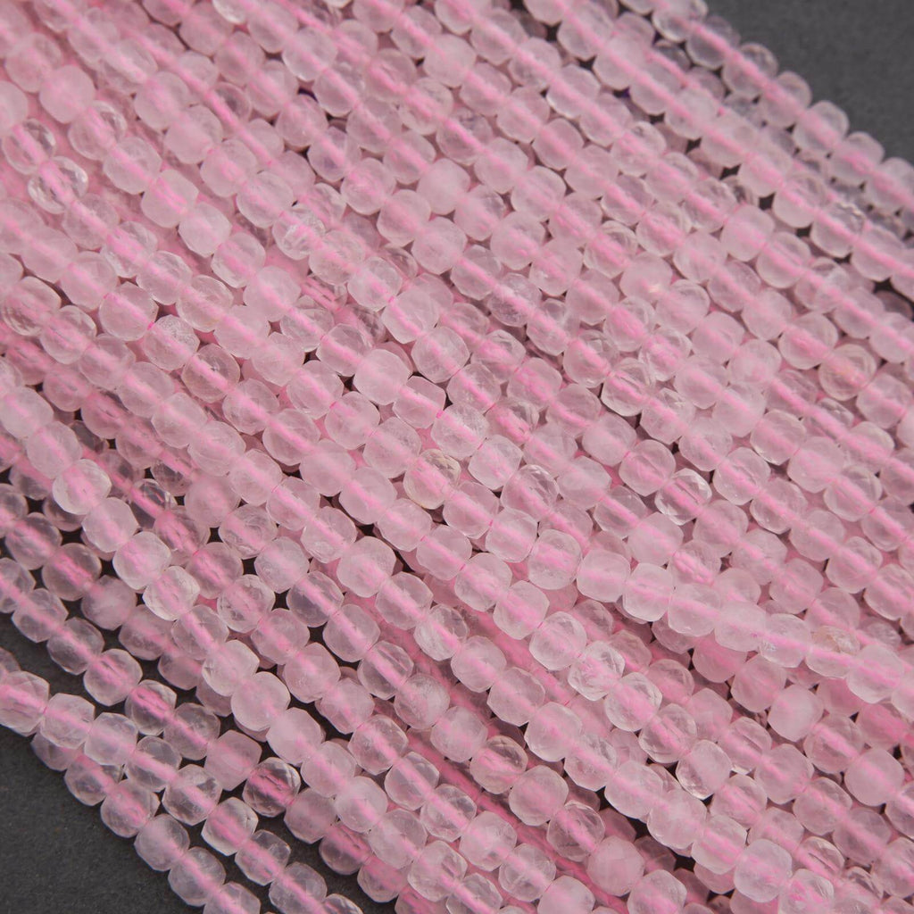 Close-up of pink glass beads on a gray background