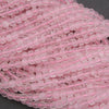 Close-up of pink beads on a string