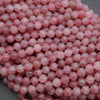 Close-up of pink beads on a gray background