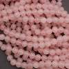 Close-up of pink beads on a dark background